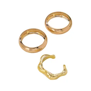3-piece set of gold minimalist bangles and an irregular wavy open design stacking cuff
