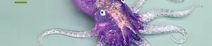 Close-up of a translucent purple glitter octopus squishy toy with realistic tentacles