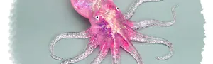 Macro detail of pink translucent glittery TPR octopus squishy stress relief toy