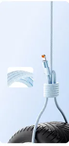 Detail showing high-density nylon braided cable lifting a heavy tire for strength.