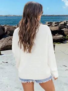 Back view of a loose white crew neck knit sweater in vintage American street style