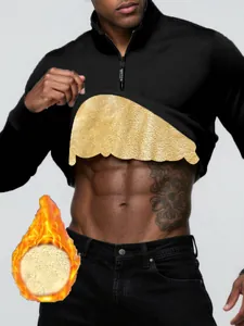 Detail of men's black half-zip sweatshirt showing warm gold fleece lining material