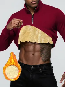 Detail view of men's burgundy half-zip sweatshirt with warm golden fleece lining.