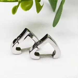 Detailed view of heart-shaped titanium steel hoop earrings with polished silver finish