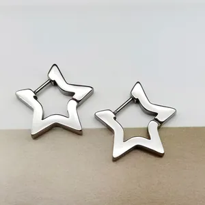 Detailed shot of silver star-shaped titanium steel hoop earrings on minimalist background
