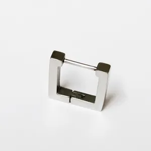 Close-up detail view of a minimalist silver square titanium steel hoop earring hinge