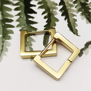 Close-up of gold-plated titanium steel square hoop earrings with polished finish.