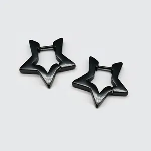 Macro detail of black star-shaped huggie hoop earrings made of durable titanium steel