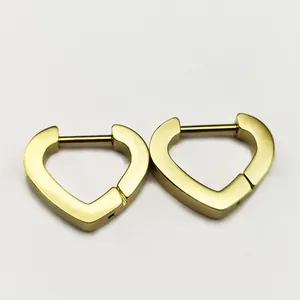 Detailed view of elegant golden heart-shaped stainless steel huggie hoop earrings