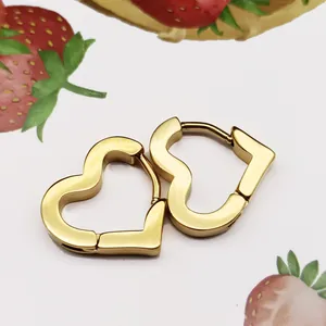 Elegant gold-finished titanium steel heart-shaped hoop earrings with a polished surface