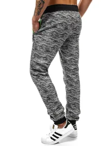 Vue détaillée du pantalon de jogging pour hommes avec motif neige et zips vert fluo