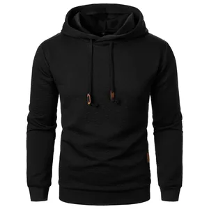 Men's premium black jacquard hooded sweatshirt with textured fabric and drawstring hood.