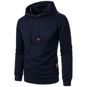 Detailed view of the navy blue men's jacquard textured hoodie with hood drawstrings