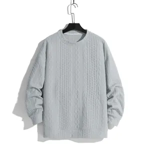 Stylish men's light grey cable-knit sweater featuring a loose fit and classic crew neck