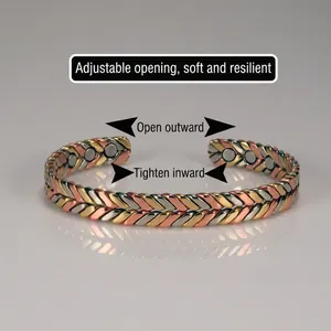 Close-up of three-tone braided magnetic therapy bracelet with adjustable cuff design.
