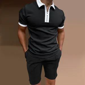 Detailed view of men's slim fit black polo shirt set featuring a white zipper collar