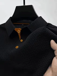Detailed view of black ice silk mesh polo shirt featuring contrast brown collar and buttons