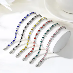 Detailed close-up of vibrant zircon tennis bracelets on a professional display stand