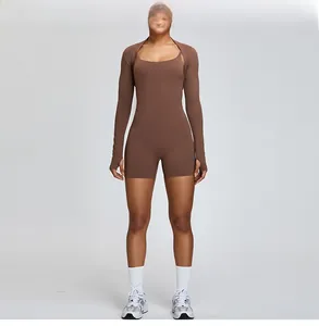 Full view showing the layered design of the brown athletic romper and shrug set