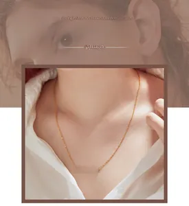 Close-up of a personalized gold rectangular bar necklace engraved for a custom look