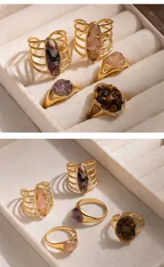 Close-up of vintage titanium steel rings with wire-wrapped details and crushed stones