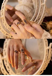 Detailed shot of vintage gold titanium steel ring set with elegant zircon inlay