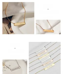 Close-up of personalized rectangular bar necklaces featuring custom Roman numeral engravings