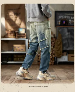Detail view of American vintage loose washed denim harem pants with raw edge stitching.
