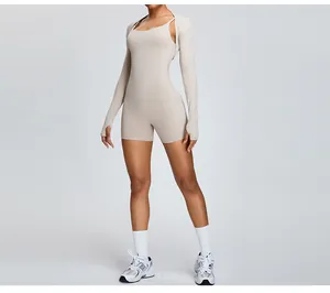 Premium beige two-piece fitness set including tight romper and long sleeve bolero shrug