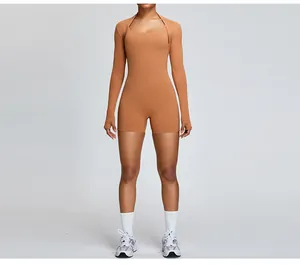 Women's camel brown long sleeve athletic bolero shrug and matching gym romper suit
