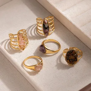 Collection of vintage gold-plated titanium steel rings with natural stone inlays