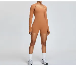 Front view of women's camel-colored fitness shrug over a matching one-piece romper