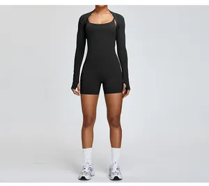 Detailed front view of the black slim-fit yoga romper and matching long-sleeve bolero shrug