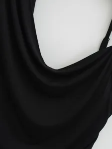 Detailed macro shot of black cowl neck halter top showing soft fabric texture and drape