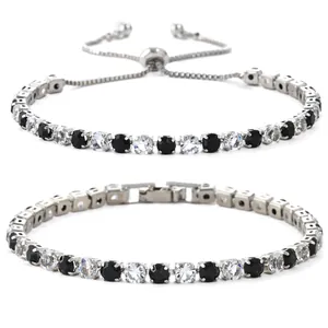 Elegante zilveren tennisarmband met afwisselend zwarte en witte zirkoniasteentjes