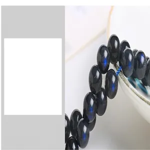 Close-up of grey moonstone loose beads with a strong blue flash for DIY jewelry