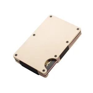Minimalist champagne gold metal card holder featuring a durable black elastic band