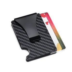 Detailed macro view of black carbon fiber RFID cardholder featuring a metal money clip