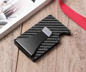Close-up of a sleek carbon fiber RFID blocking card holder with metal money clip