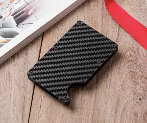 Detailed view of carbon fiber card holder with RFID blocking and metallic texture