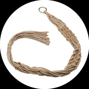 Close-up detail of bohemian hand-woven jute macrame plant hanger with metal ring