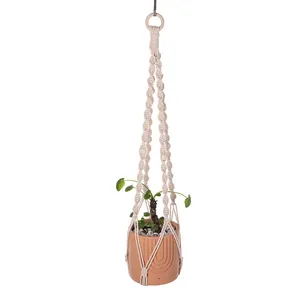 Handmade macramé plant hanger with wooden beads for bohemian indoor wall decor