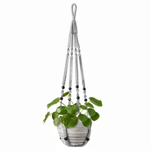 Handcrafted grey macramé plant hanger with black beads for bohemian indoor wall decor