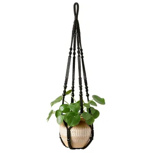Black handmade macrame plant hanger with beads for indoor Bohemian style home decor