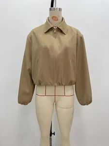Detailed view of a stylish khaki women's zip-up jacket with a puff hem on a mannequin