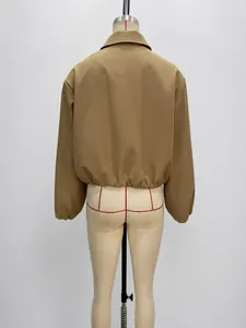 Back view of stylish khaki cropped puff jacket on mannequin showing elastic hem detail