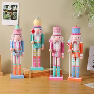 Set of four macaron-colored wooden Nutcracker ornaments for Christmas decoration