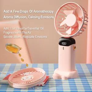 Portable handheld mini fan in pink with digital display and aromatherapy function