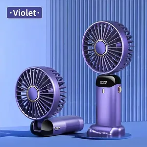 Portable handheld mini fan with digital display and foldable phone stand in purple