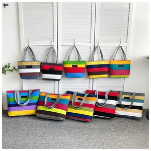 Collection of large capacity canvas tote bags in various colorful striped patterns and designs